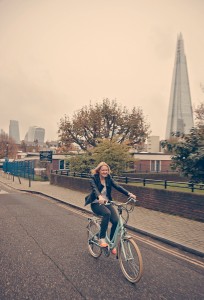 Woman on e-bike with Shard in the background