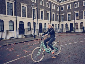 Lady on VOLT Kensington cycling through London