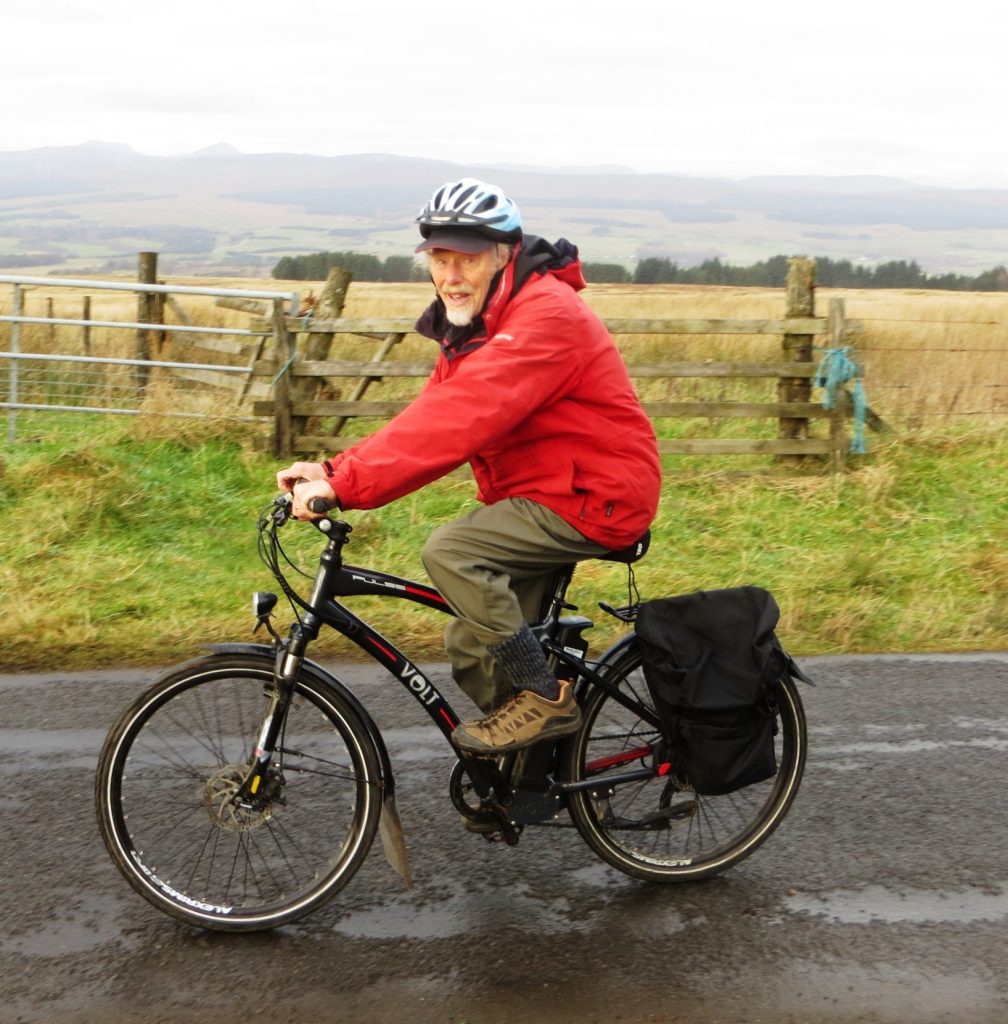 80-year-old cyclist Roy Baker rides his VOLT Pulse e-bike through the fields