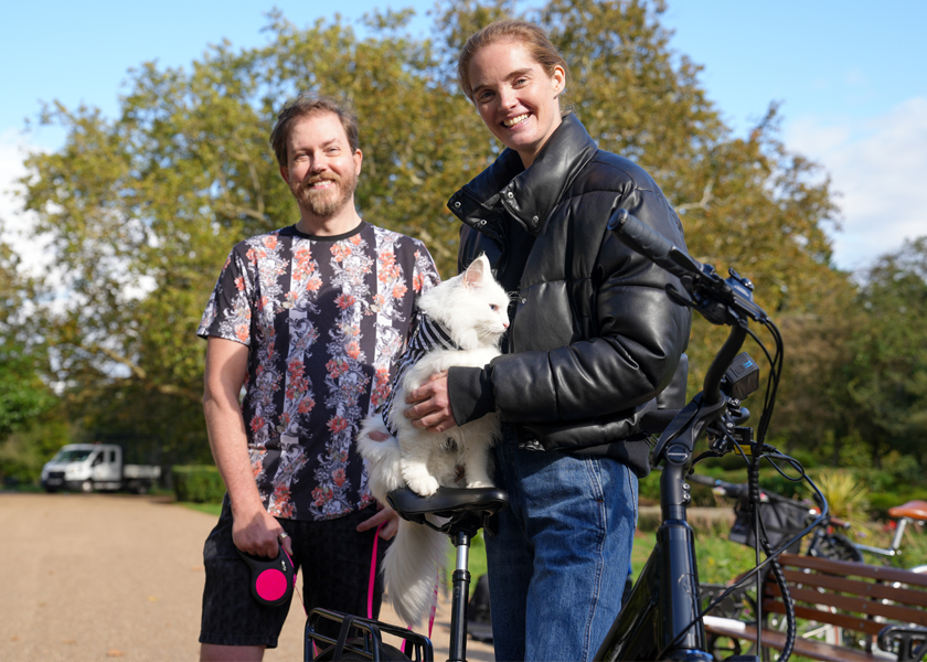 happy couple with VOLT burlington Ebike and a fluffy cat
